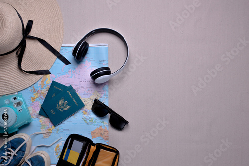 Creative flat lay composition of various traveler or holiday accessories for travel concept background