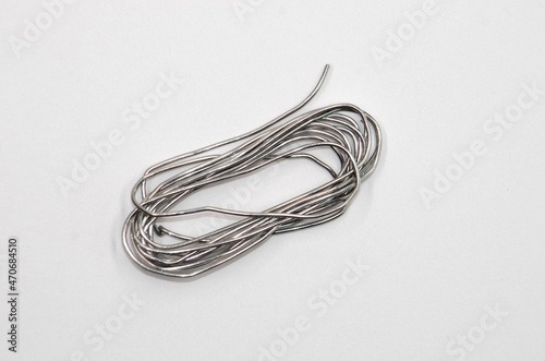 A skein of solder on a white background