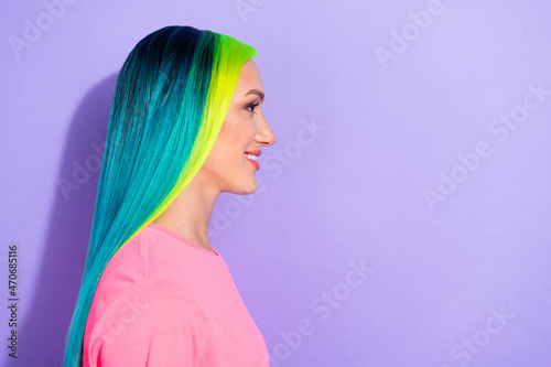 Profile side photo of teal blue multicolored haired lady look empty space isolated over purple color background