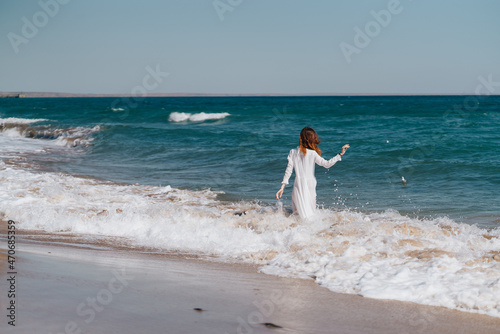 Woman in white dress near the ocean walk fresh air landscape