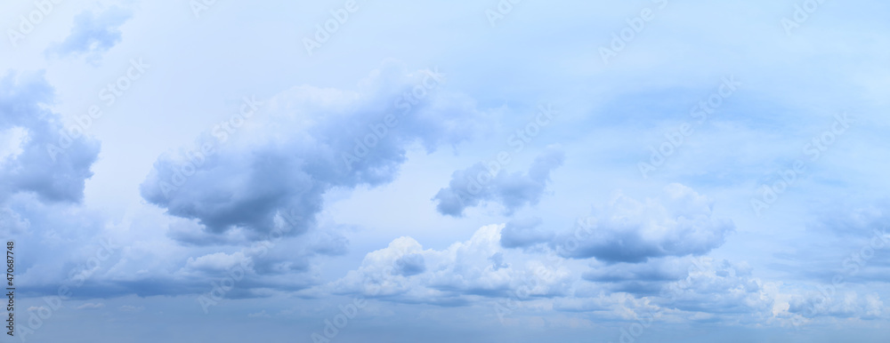 Summer cloudy sky.
Photographic image, white, blue colors
monochrome, panorama, horizontal.