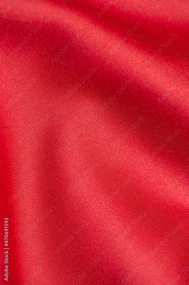 Red satin fabric background. Copy space. Vertical photo Red satin fabric background. Copy space. Vertical photo