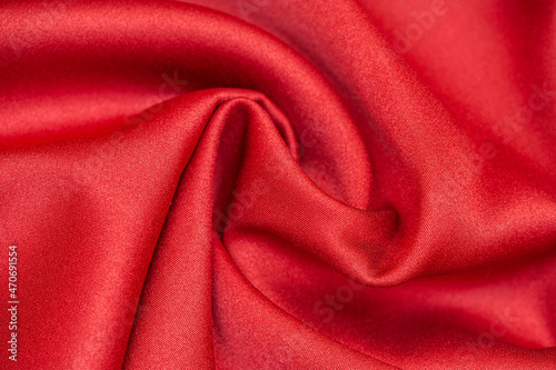 Red satin fabric. Fabric background