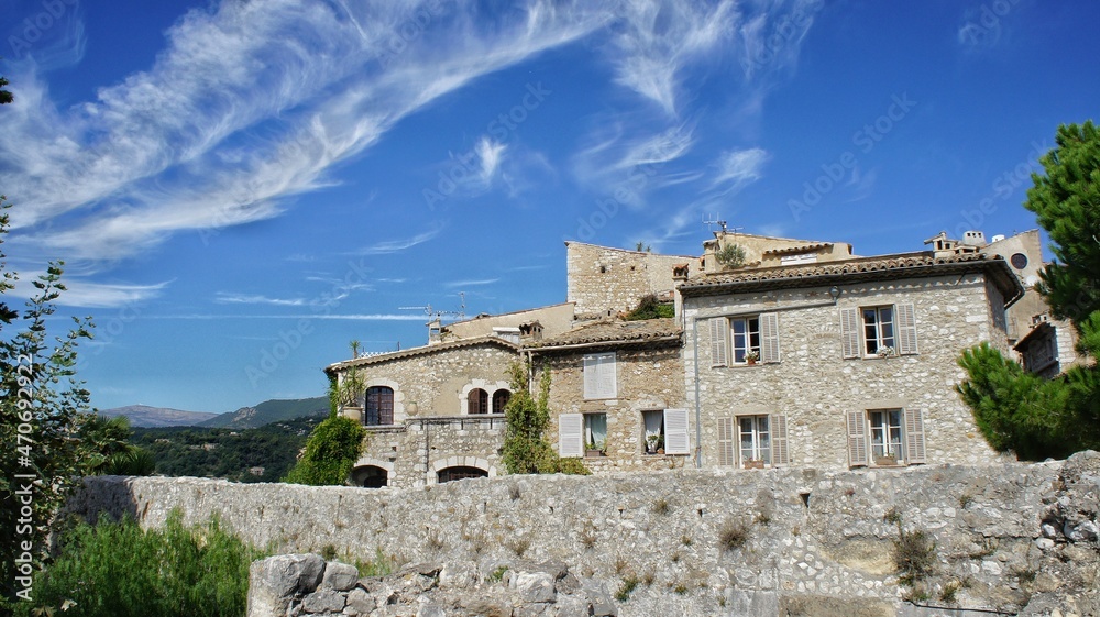 Provence, France, September 2010, view of the wall and the old stone city against the blue sky