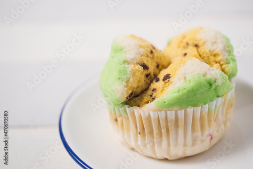 Steamed tart or known as bolu kukus in Indonesia isolated in white photo