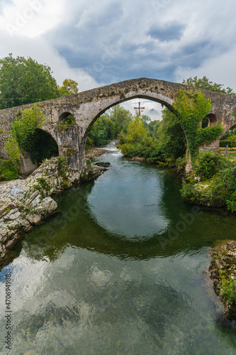 View of the Roman bridge in the city of Cangas de Onis in Asturias.  photo