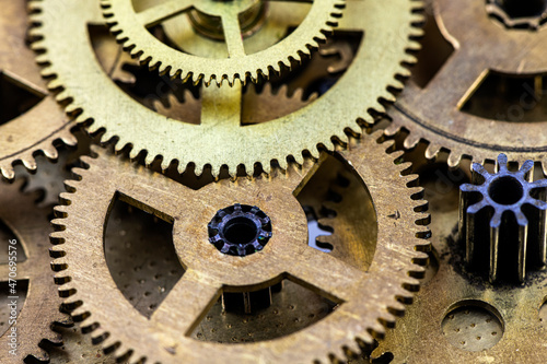 Old clockwork gears as background.