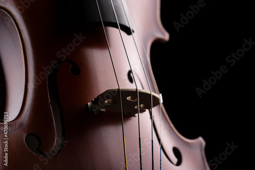 A part of a violin or a viola on a black background