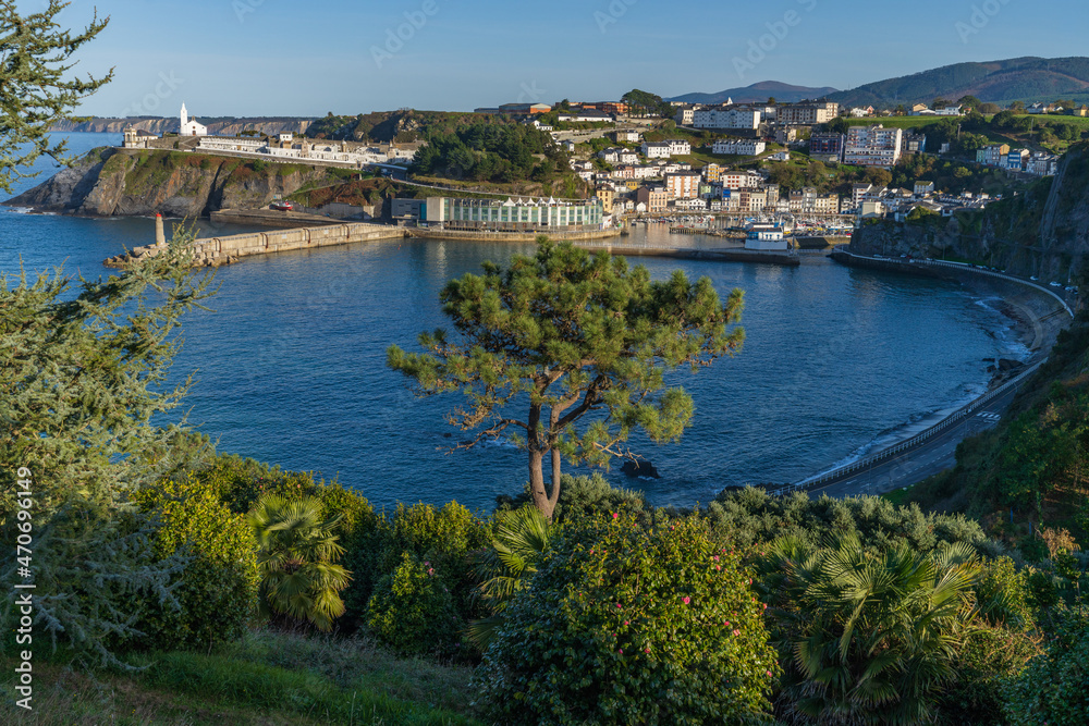 View of the Asturian city of Luarca. In the background the lighthouse and the picturesque cemetery by the sea. 