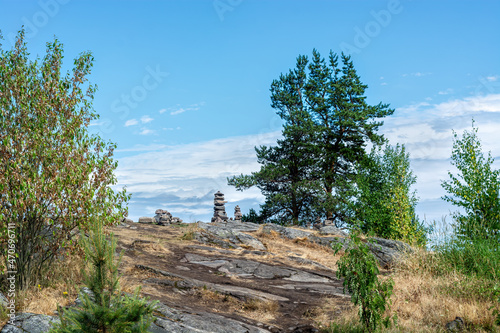 Landscape with a pyramid made of stones on Mount Paasonvuori near the town of Sortavala in the Republic of Karelia. photo