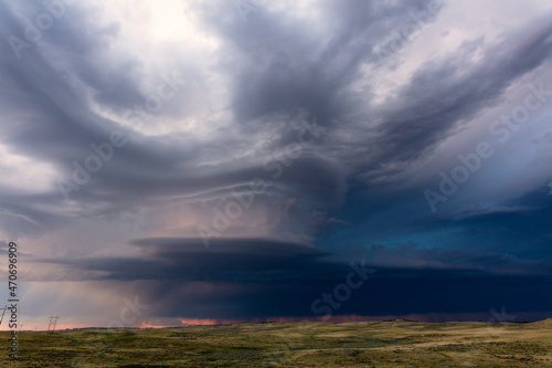 Supercell storm clouds over a field in Wyoming © JSirlin