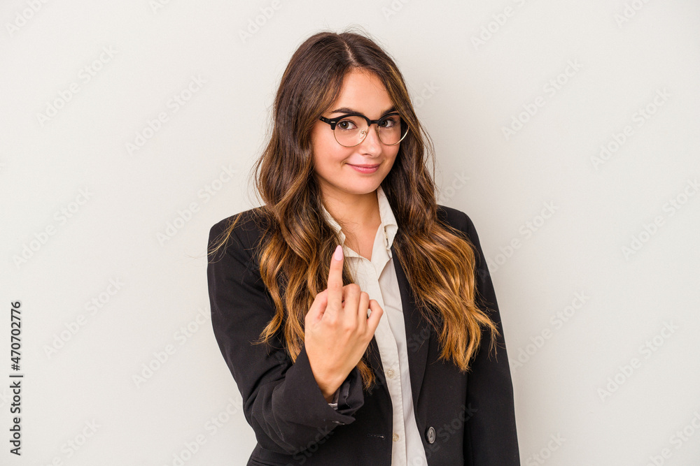 Young caucasian business woman isolated on white background pointing with finger at you as if inviting come closer. Young caucasian business woman isolated on white background pointing with finger at you as if inviting come closer.