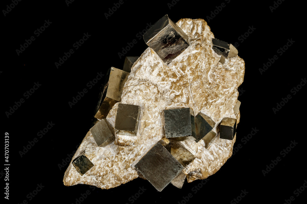 Macro stone Pyrite mineral in rock on a black background