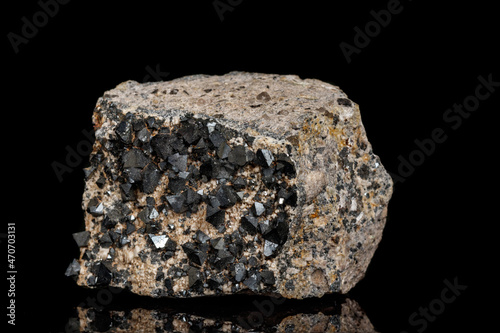 Macro Magnetite mineral stone on black background photo