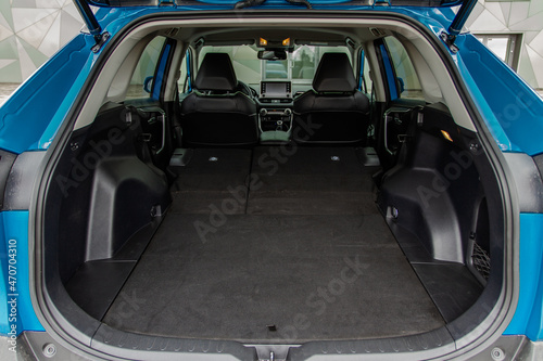 Huge, clean and empty car trunk in interior of compact suv. Rear view of a SUV car with open trunk