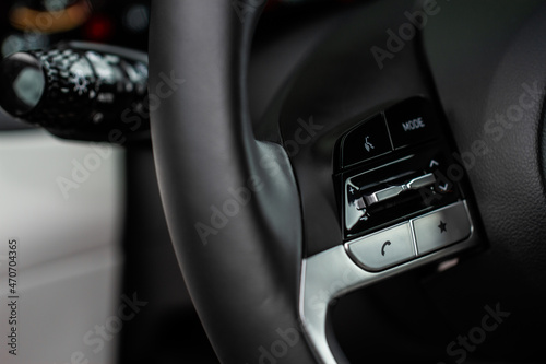 Multiple buttons on the steering wheel to accept or reject calls from the phone close up view. Answer and reject phone buttons.