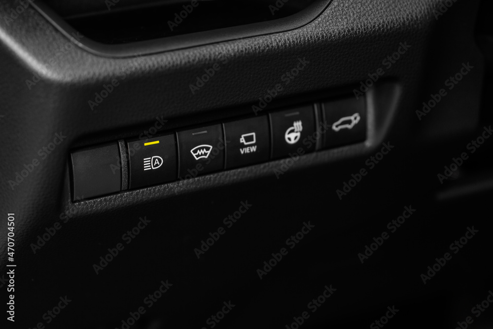Headlight switch on of modern car. Automatic control of switching on and off the car light. Headlight switch on of modern car. Automatic control of switching on and off the car light.