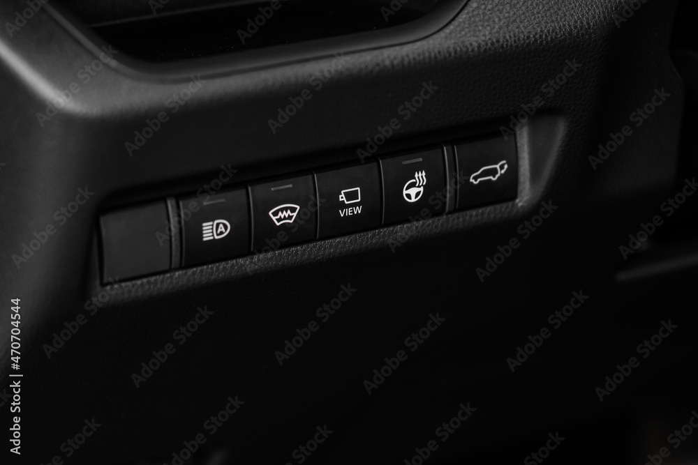 Close up view of modern car electronic safety systems control panel. Modern car interior detail.