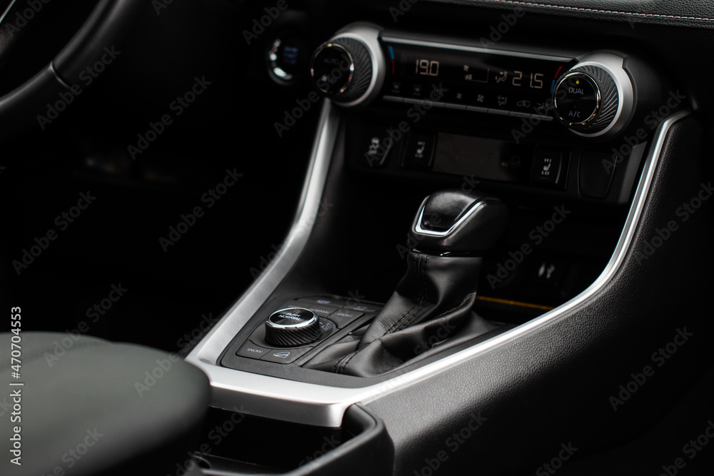 Car interior console close up view. Gear stick with multimedia console.