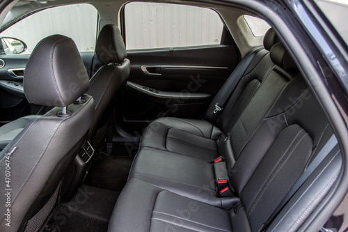 Modern sedan car inside. Leather back passenger seats in modern luxury car. Comfortable leather seats.