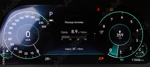 Modern light car black and blue mileage. Car dashboard with sensors and information. RPM, Fuel indicator and temperature.