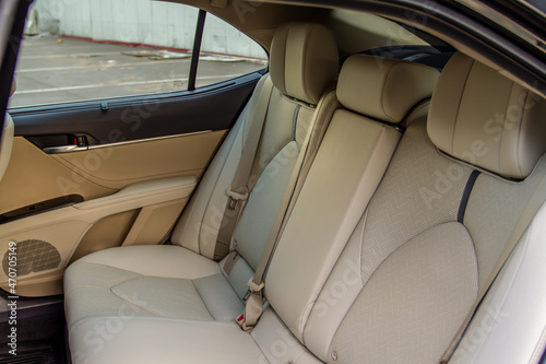 Modern sedan car inside. Leather back passenger seats in modern luxury car. Comfortable leather seats.