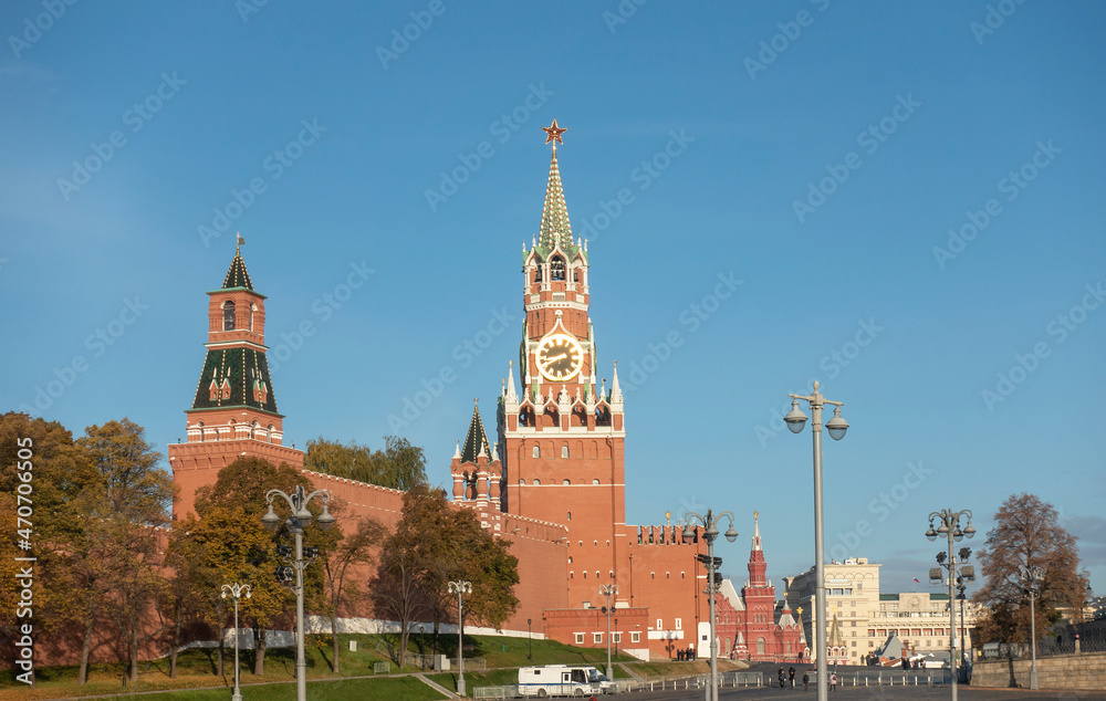 View of the Kremlin's Spasskaya Tower in Moscow illuminated by the morning sun