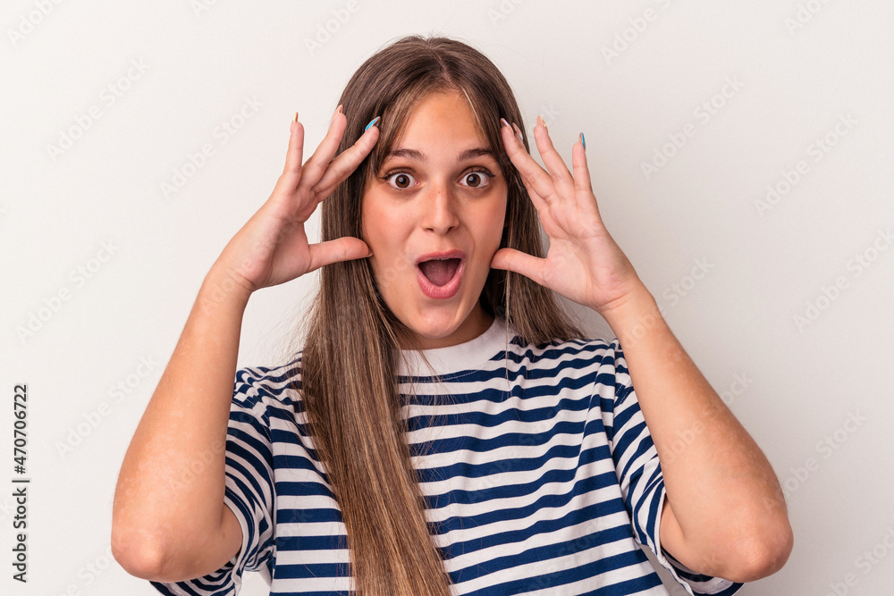 Young caucasian woman isolated on white background receiving a pleasant surprise, excited and raising hands. Young caucasian woman isolated on white background receiving a pleasant surprise, excited and raising hands.