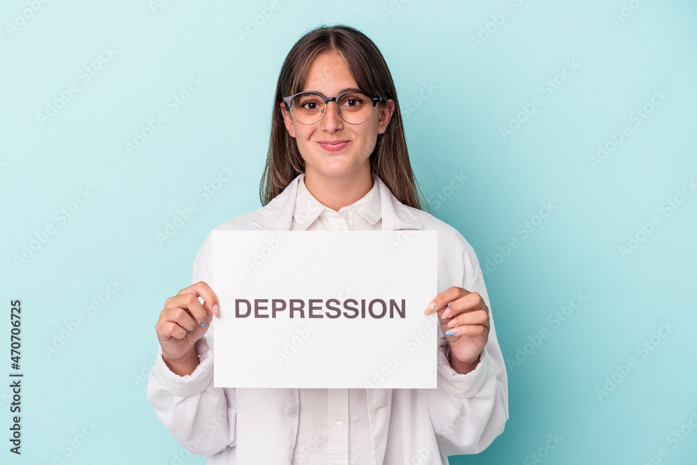 Young doctor caucasian woman holding depression placard isolated on blue background Young doctor caucasian woman holding depression placard isolated on blue background