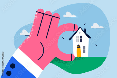 Broker hold house in hand recommend real estate agency services 