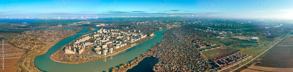the Yubileiny microdistrict of the city of Krasnodar on the bend of the Kuban River and the Adyghe coast - a large aerial panorama on a sunny day in late autumn