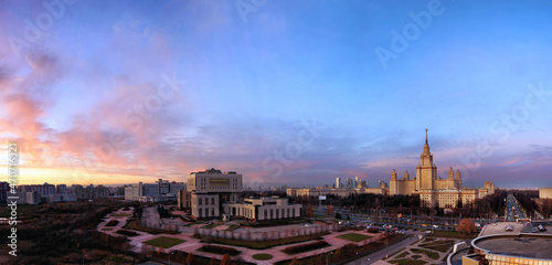 Wide angle aerial panorama of autumn campus of Moscow University under dramatic sunset cloudy sky © boligolovag