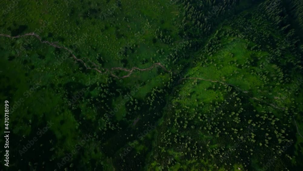 Aerial View of Carpathian Mountains rage, view from above on the forest and hiking trail. Tourist places of Ukraine. Concepts of tourism, environment and nature landscape. Aerial View of Carpathian Mountains rage, view from above on the forest and hiking trail. Tourist places of Ukraine. Concepts of tourism, environment and nature landscape.