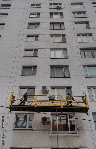  Russia construction cradle with workers photo