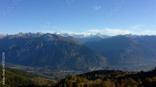 Rhone Valley And Sierre City With Swiss Summits In Background From Crans-Montana Ski Resort, Valais, Switzerland. - wide shot photo