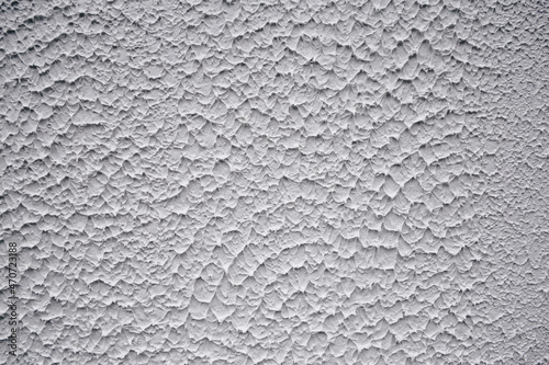 Texture white wall with relief plaster. Front view