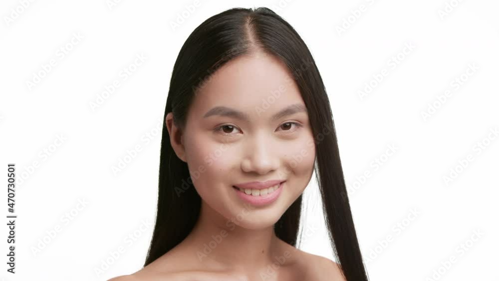Korean Woman Brushing Brunette Hair With Comb Over White Background Korean Woman Brushing Brunette Hair With Comb Over White Background