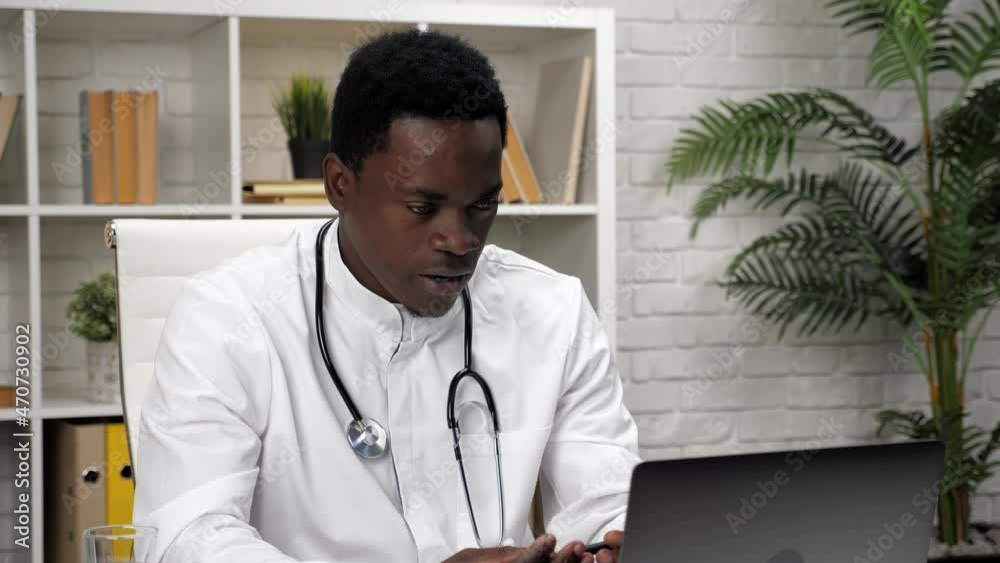 African American man online doctor talking patient remote video call ...