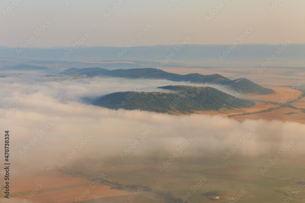 Aerial view of the mountains and fields in Bulgaria. View from a plane