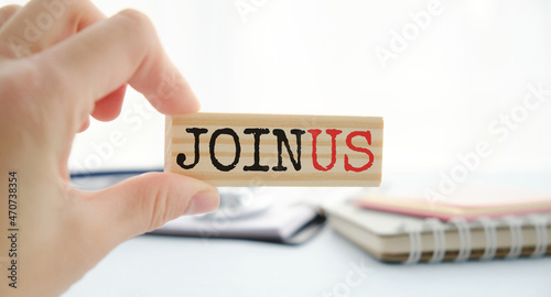Join us concept on wooden cubes against blue background. Business job vacancy or community membership announcement concept.
