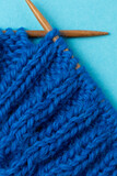blue knitting wool in rib stitch