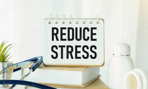 Reduce stress text concept write on notebook with pills