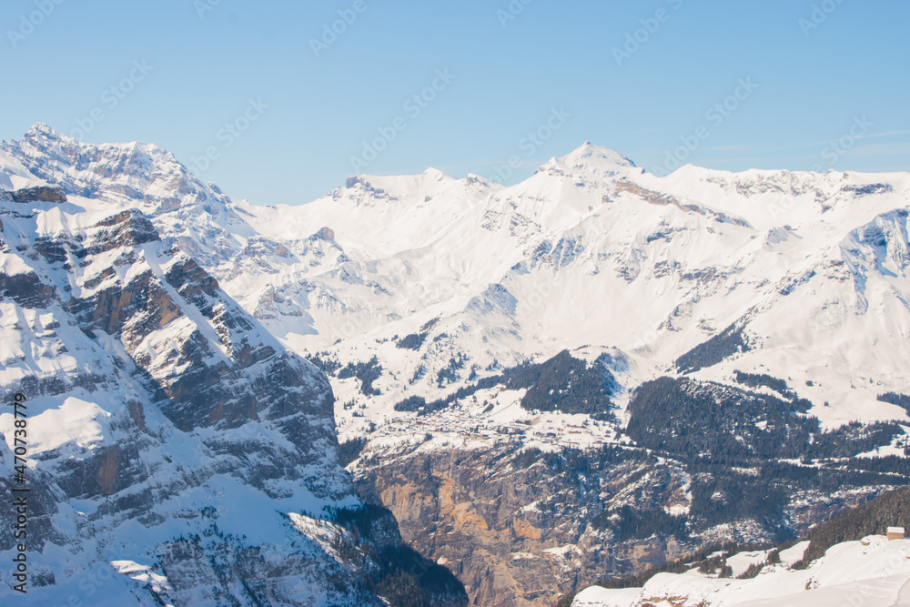 Beautiful panoramic view of snow-capped mountains in the Swiss Alps..