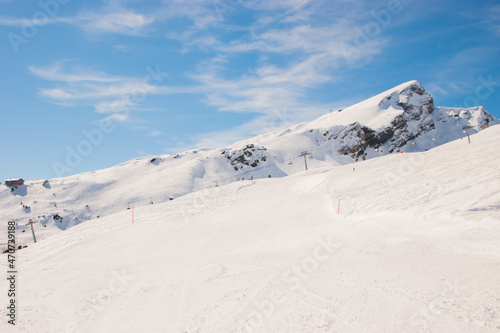 Beautiful panoramic view of snow-capped mountains in the Swiss Alps.