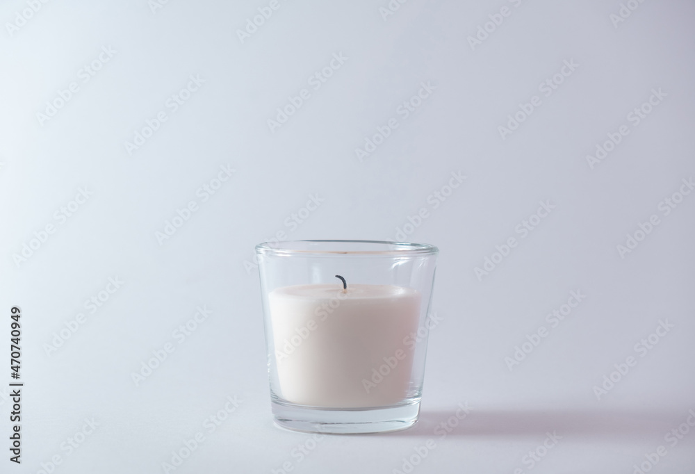 Extinguished candle on a white background. New Year's concept.Copy space Extinguished candle on a white background. New Year's concept.Copy space