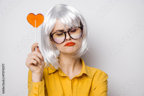 cheerful glamorous woman with a lollipop in her hands model © VICHIZH