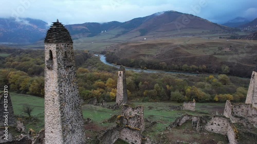 Flying between ancient towers of Egikal complex out of the river. Republic of Ingushetia. Caucasus mountains, Russia photo