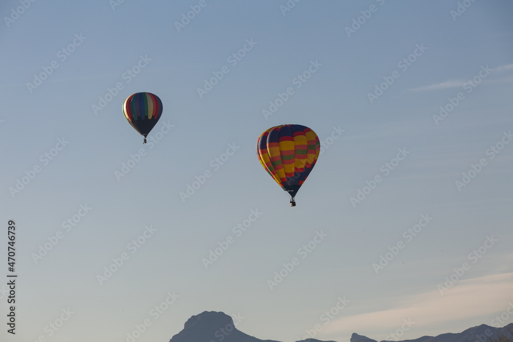 Fototapeta premium two hot air balloons flying in the Arizona sky 