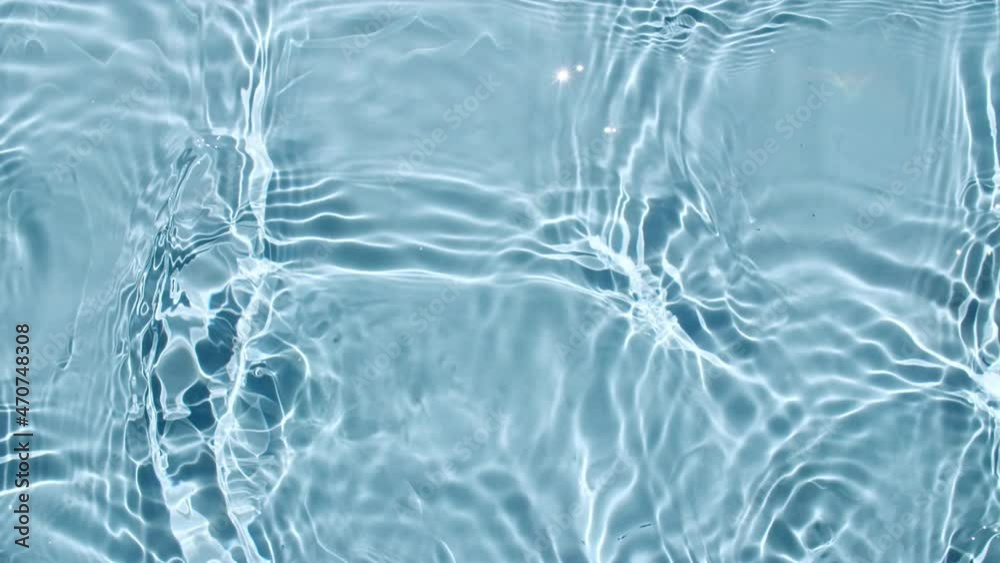 Water surface texture top view. Water waves blue colored. Sun and shadows. Pure blue water with reflections sunlight in slow motion. Motion clean swimming pool ripples and wave. 4k. High quality 4k Water surface texture top view. Water waves blue colored. Sun and shadows. Pure blue water with reflections sunlight in slow motion. Motion clean swimming pool ripples and wave. 4k. High quality 4k