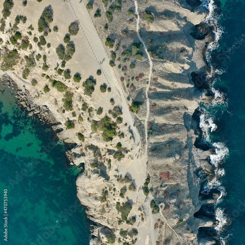 Panorama of cape Kaptchick, South Crimea. aerial photography. Blue sea and yellow rocks with green bushes. Camera straight down